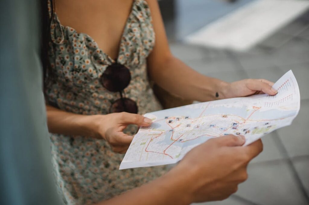 Couple looking at map of town during scavenger hunt event